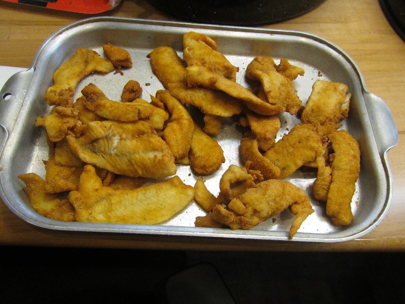 A platter of cooked fish.